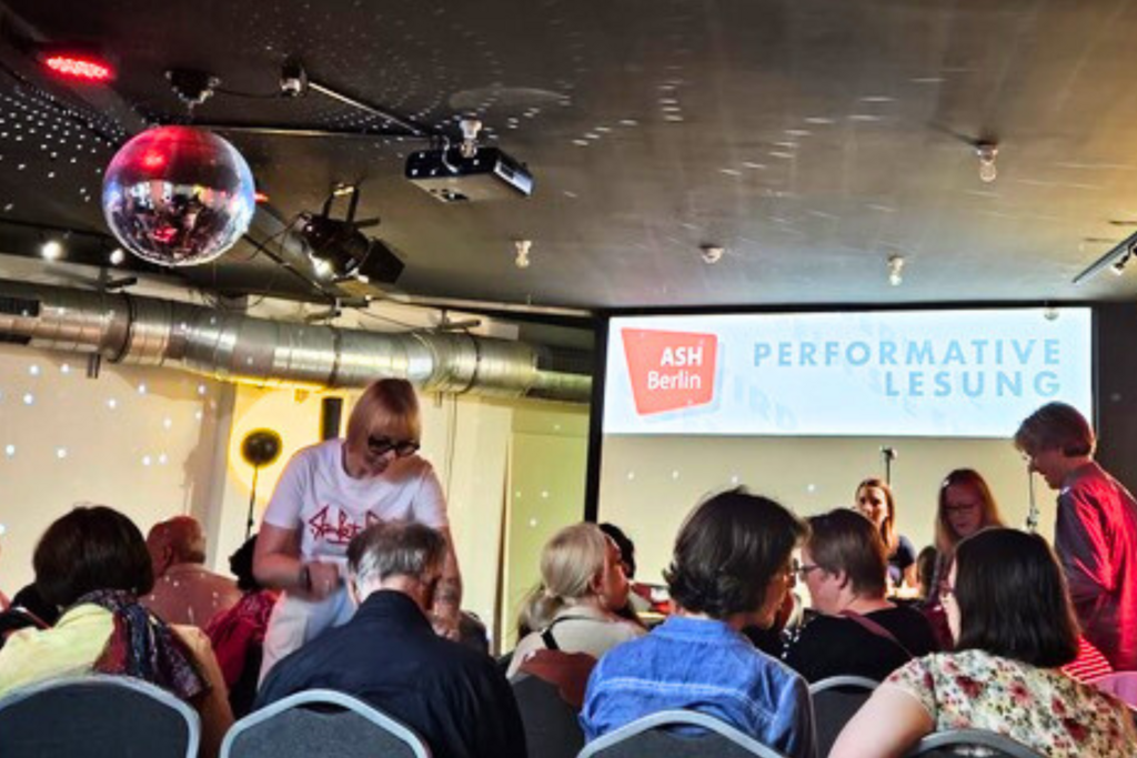 View from the audience to the stage of the reading
